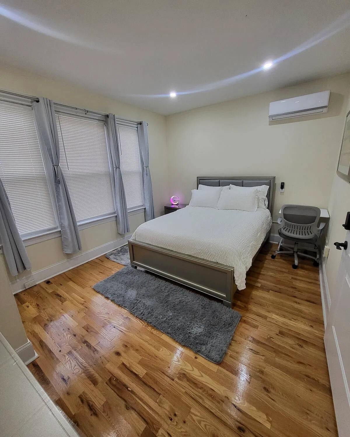 OoohLaLa@Newark — Natural light and an uncluttered setting make this bedroom a calming retreat.